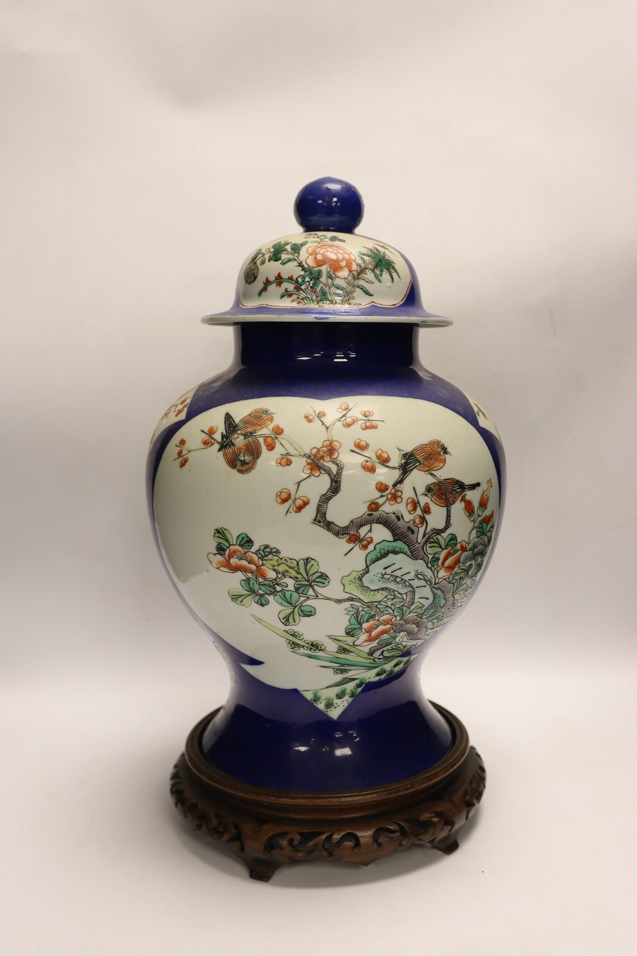 A Chinese powder blue vase and cover, Guanxu period, on wooden stand, 44cm